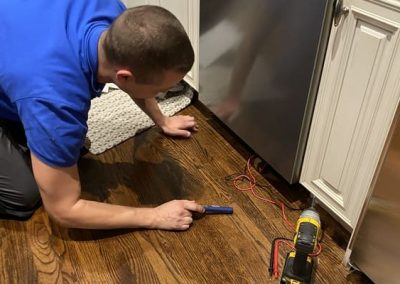 By the customer leak from the dishwasher underneath.